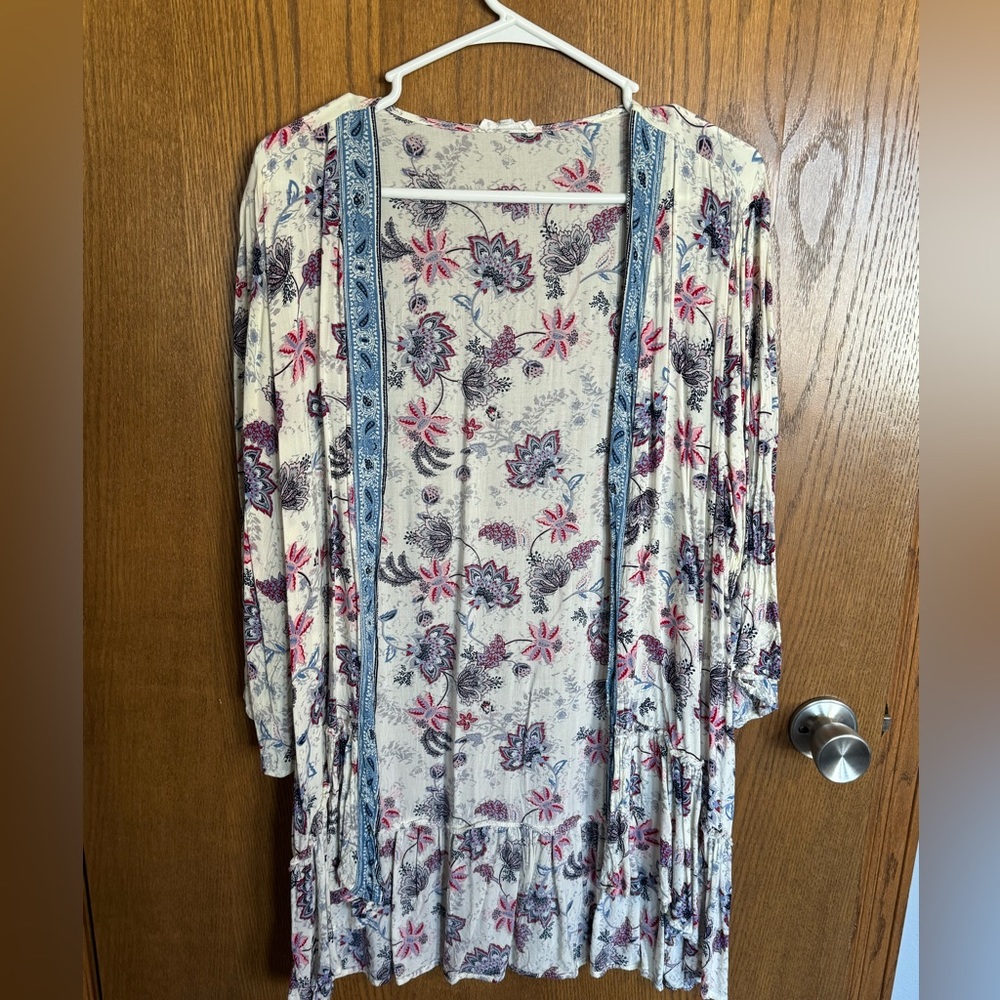 Maurice’s size one light weight cardigan type shirt.  Only worn once.